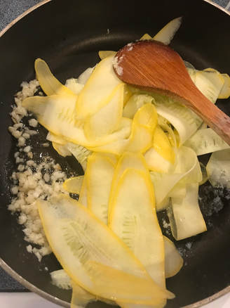 Saute garlic and butter then add squash ribbons.